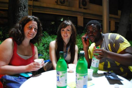 Enjoying makgeolli with friends at a campus festival