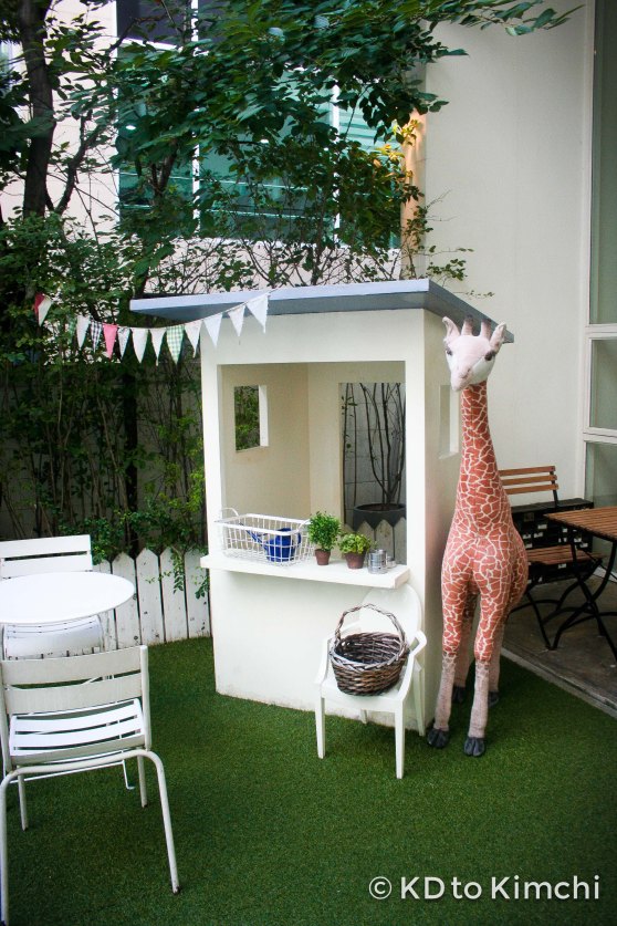 Giraffe and garden in the front 