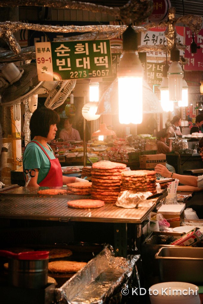 A woman selling mung bean pancake (bindatteok - 빈대떡)