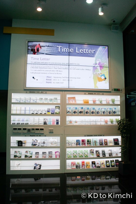 Brochures on Gangnam attractions, and an ad for Hyundai Department Store's "100-Day Time Letter Service"